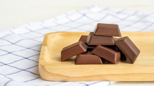 Chocolate on a wooden plate.