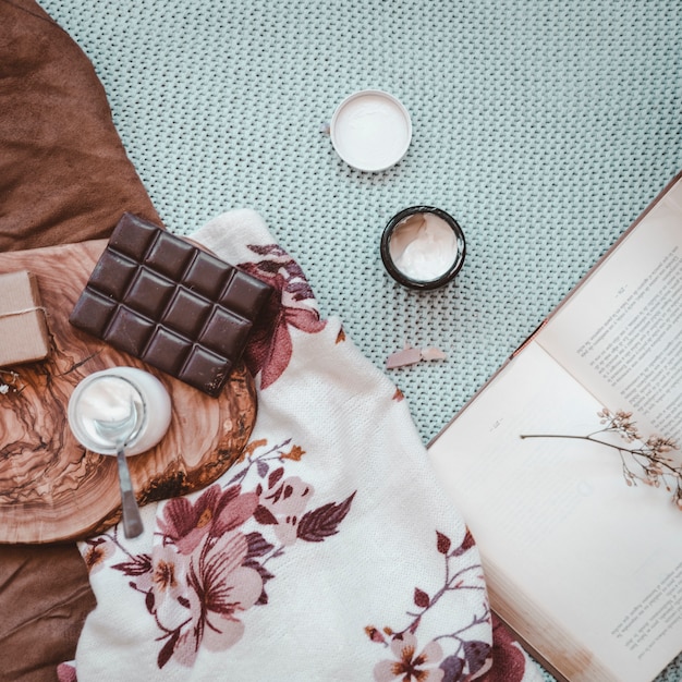 Photo chocolate and yogurt near book