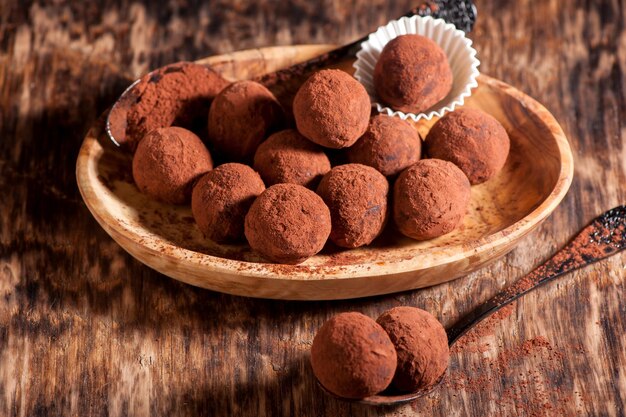 Chocolates truffles on a wooden background horizontal