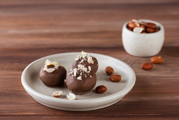 Chocolates with peanuts on a plate sugar gluten and lactose free vegan