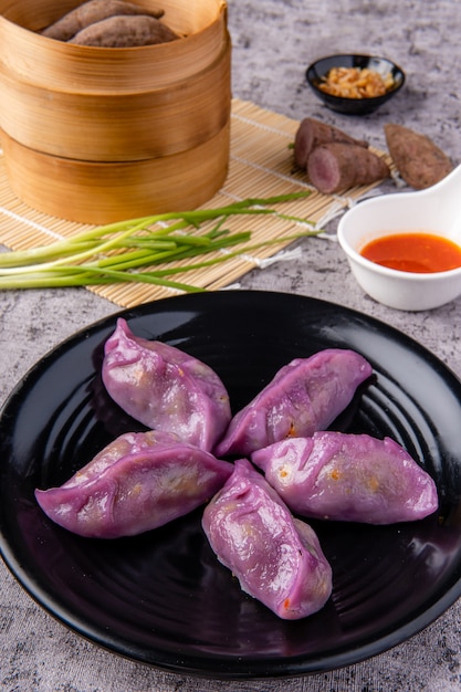 Choi pan steamed vegetable dumplings also known as Chai Kwe or Chai Kue is one of the many special traditional Asian delicacies and this Choi Pan is made from purple sweet potato