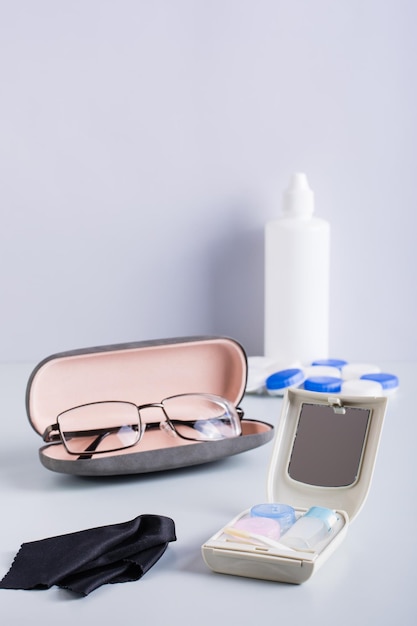 Choice between glasses and contact lenses items for care and\
storage vertical view