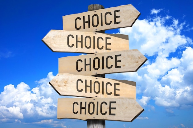 Choice wooden signpost with five arrows sky with clouds in background