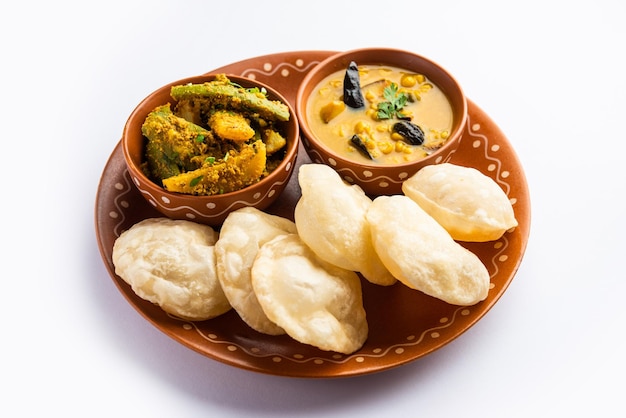 Photo cholar dal and patol aloo sabzi served with fried luchi or poori bengali food