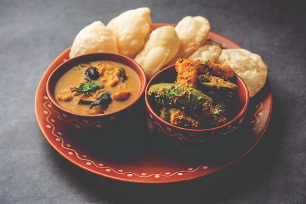 Cholar dal and patol aloo sabzi served with fried Luchi or poori bengali food