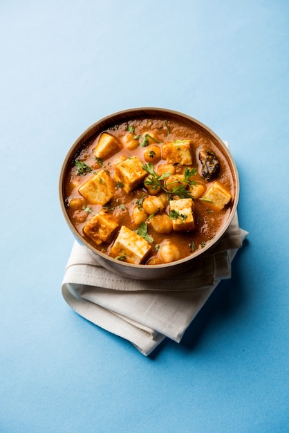 Chole Paneer curry made using boiled chickpea with cottage cheese with spices. Popular North Indian recipe. served in a bowl or serving pan. Selective focus