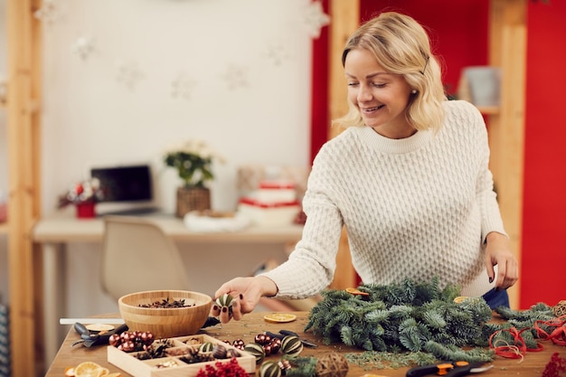 Choosing Christmas decorations for wreath