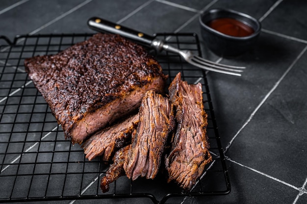 Chopped Beef Brisket barbecue Traditional meat rubbed with spices and smoked in a Texas smoker Black background Top view