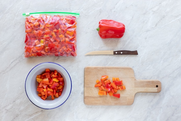 Chopped bell peppers on a wooden cutting board