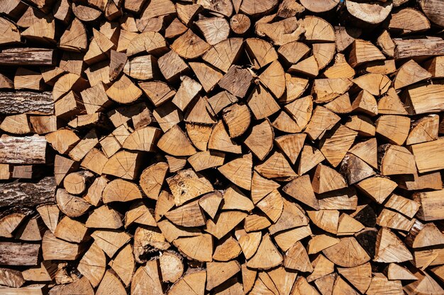 Chopped firewood is stacked in a big pile