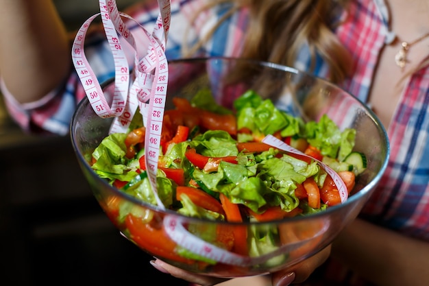 Chopped fresh vegetable salad in a plate for a vegetarian girl