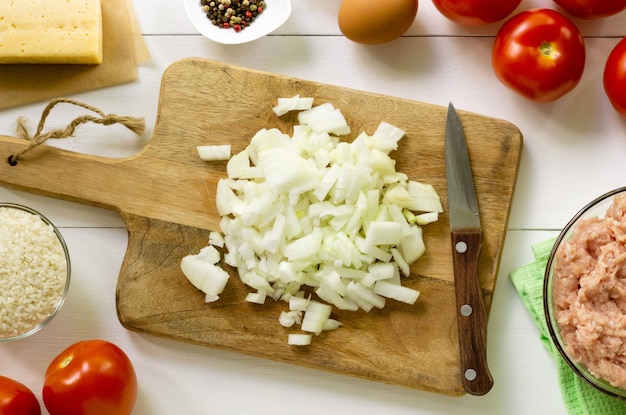 Chopped onions on a wooden board