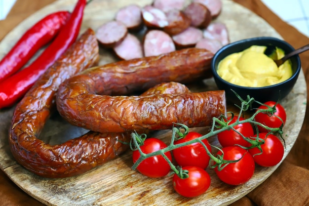 Chopped smoked sausages Fresh homemade sausages on a wooden board