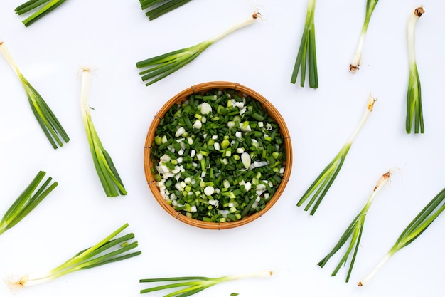 Chopped spring onions on white background