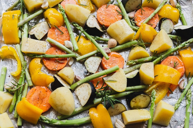 Chopped stewed vegetables on tray with herbs and olive oil food