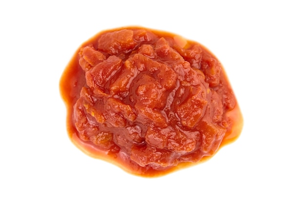 chopped tomatoes in tomato juice isolated on white background top view