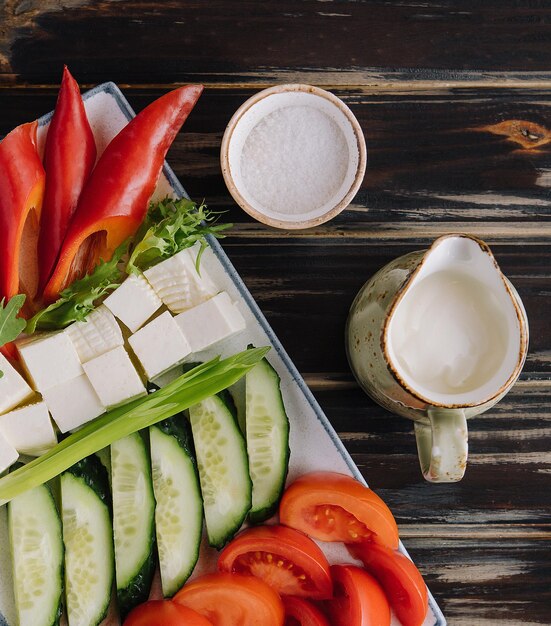 Chopped vegetables with goat cheese on a plate