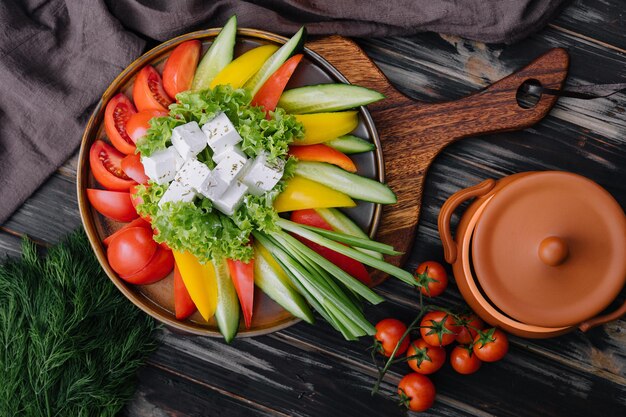 Chopped vegetables with goat cheese top view