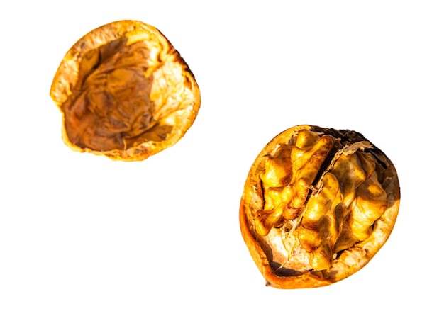 Chopped walnut fruit on a white background