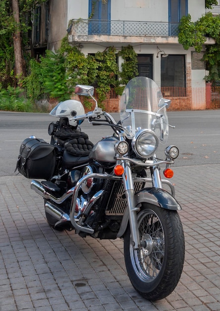 Chopper motorcycle stands on road i in Greece