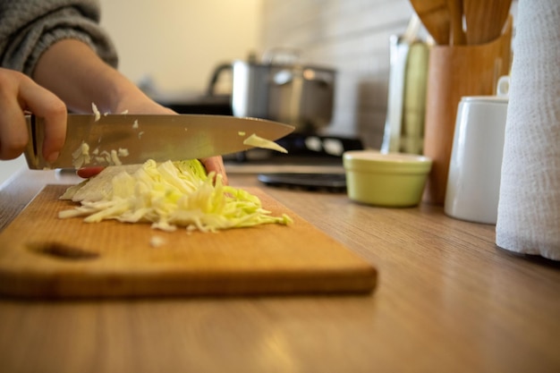Chopping cabbage on cut board