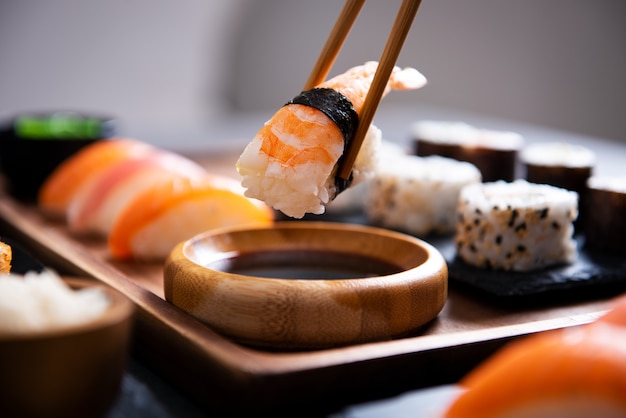 Photo chopstick with nigiri sushi piece