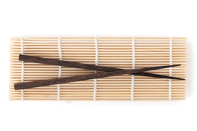 Chopsticks over bamboo mat