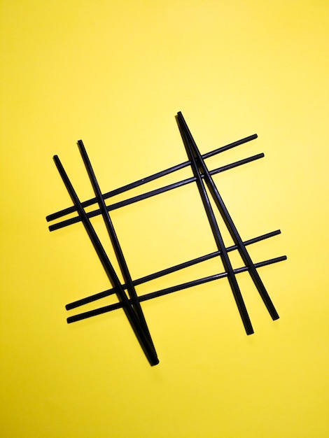 Photo chopsticks on yellow background