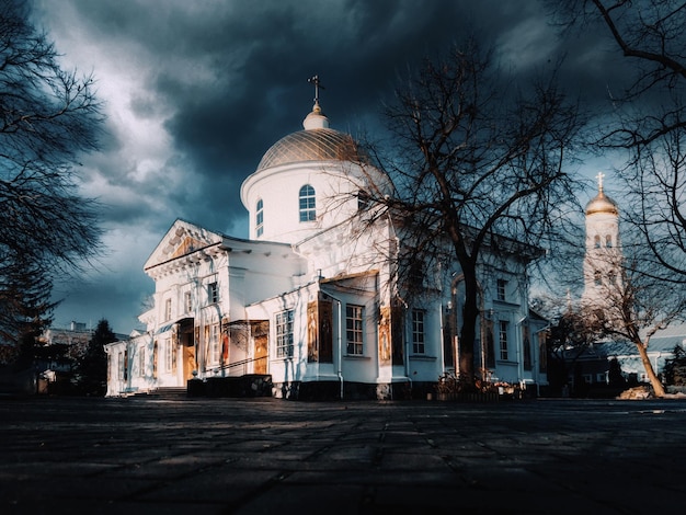 Christian church against the background of dark clouds Illustration