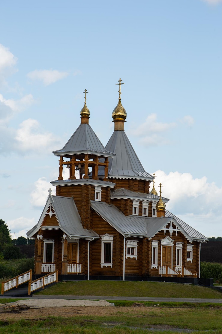 Photo christian church from a wooden frame orthodox church with bell tower built of wood vertical photo