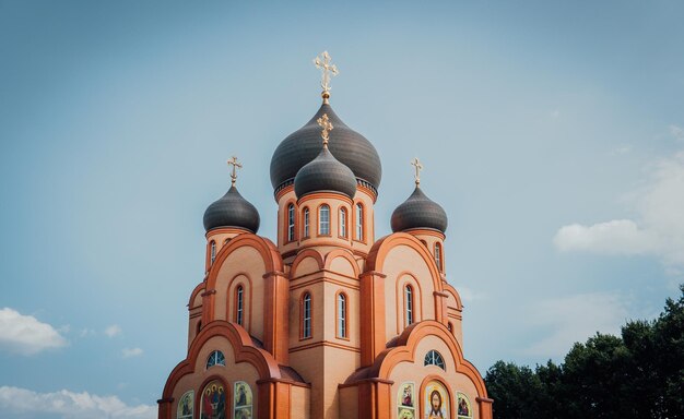 Christian church with golden crosses christian temple in russia\
the church of the christian church is a monument of russian\
spiritual and religious architectural tradition and orthodoxy