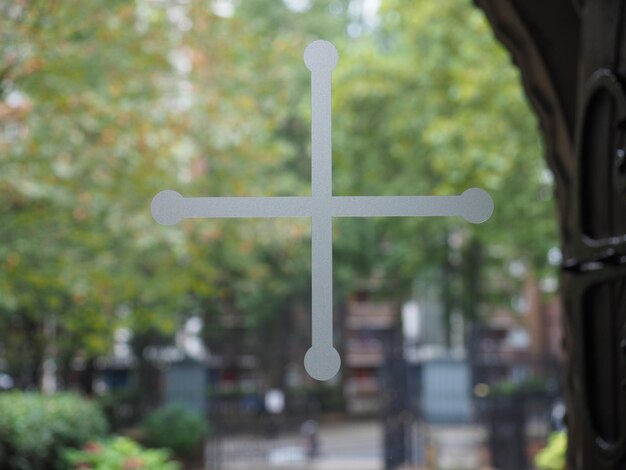 Christian cross on a church window