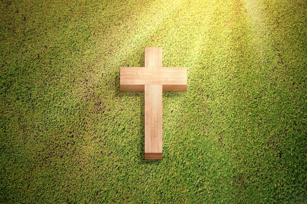 Christian cross on the green grass