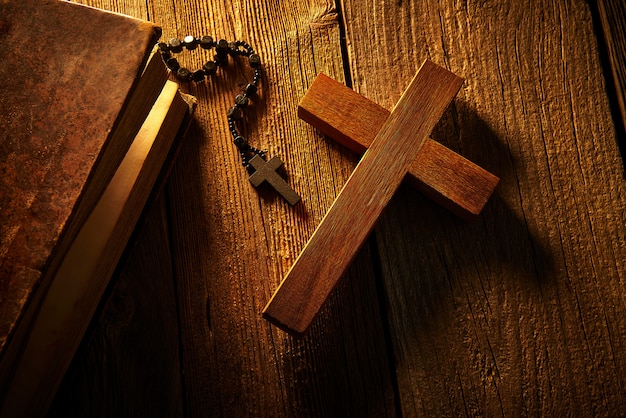 Christian cross on wood bible and rosary