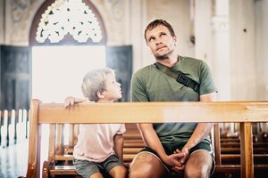 Christian dad tells child bible story about jesus holy people sit in kirk faith religious education modern church father's day responsibilities influence on worldview life lessons raising boy