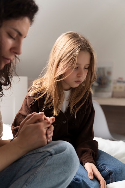 Christian family praying together