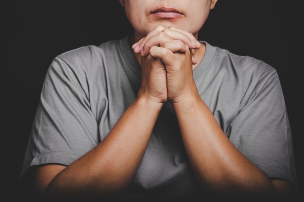 Christianity woman catholic hand pray and worship in the church\
hands folded in prayer