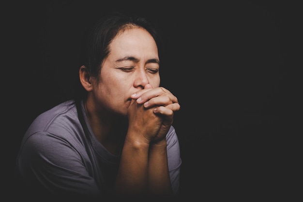 Christianity woman catholic hand pray and worship in the church\
hands folded in prayer