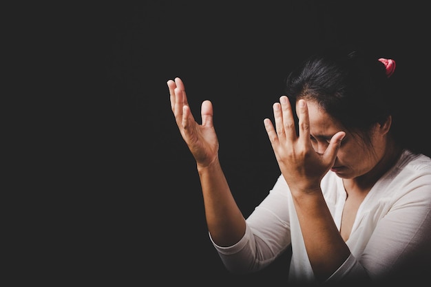 Christianity woman catholic hand pray and worship in the church\
hands folded in prayer