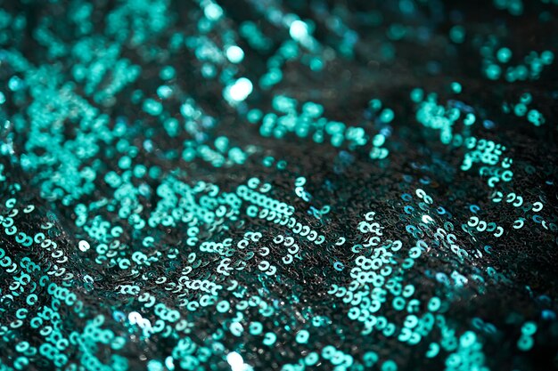 Christmas abstract background made of emerald green sequins