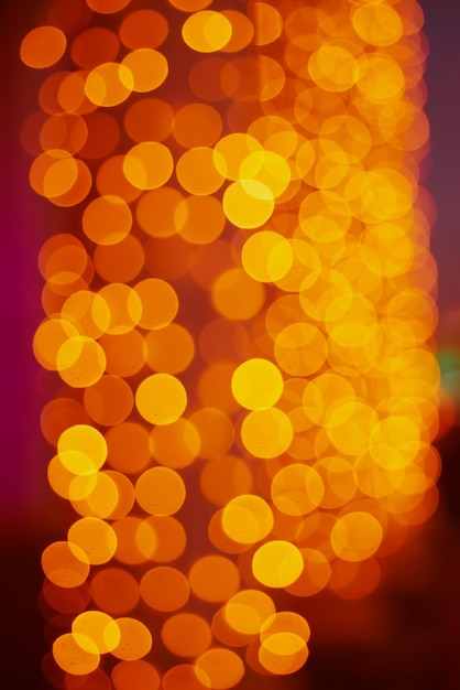 Christmas abstract shiny bokeh in yellow golden colors new year illunination Seasonal vintage hipster holiday background