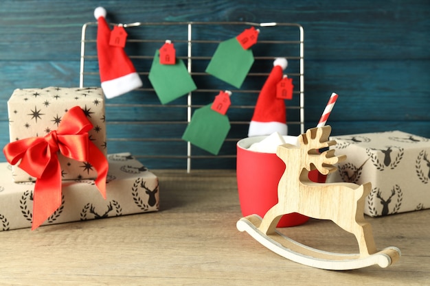 Christmas accessories on wooden table, close up.