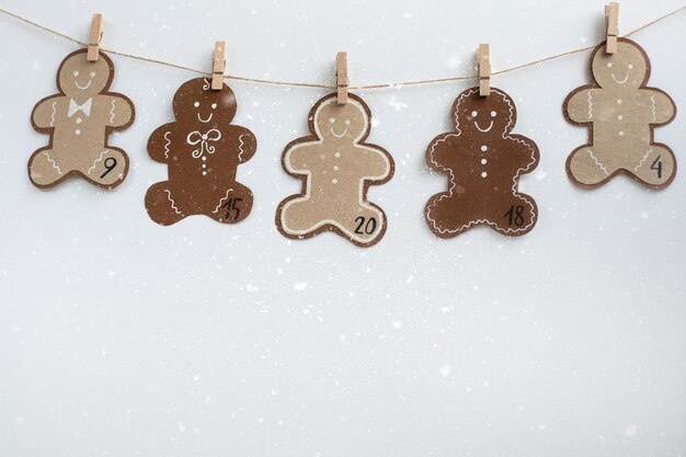 Christmas Advent calendar Figures in the form of smiling gingerman cookies Concept hobby DIY