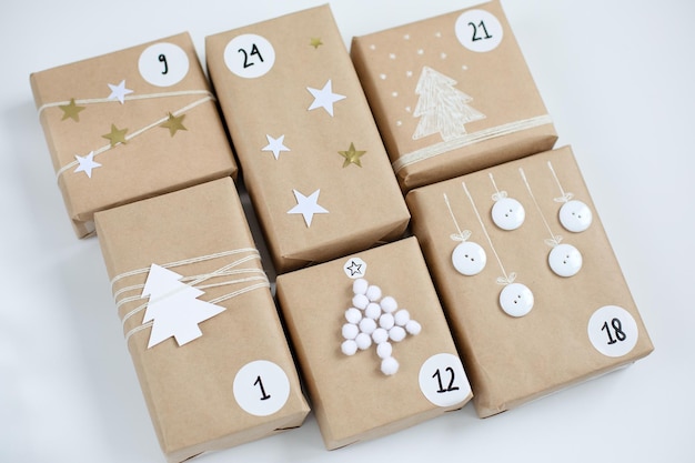 Christmas Advent calendar gift boxes with numbers on a light background DIY and hobbi concept