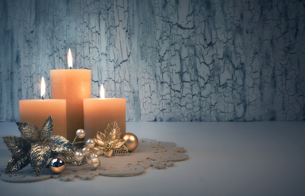 Christmas advent candles with golden decorations