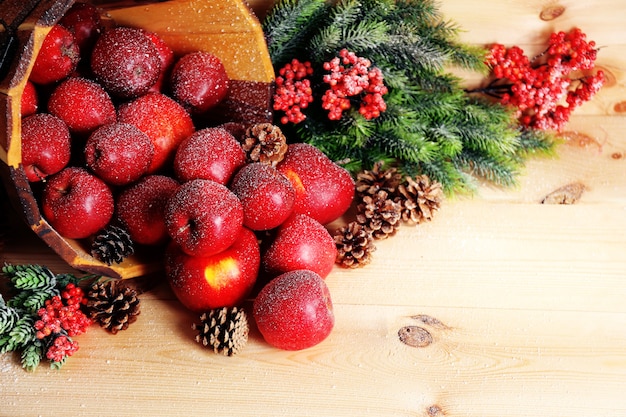 Christmas apples on wooden table