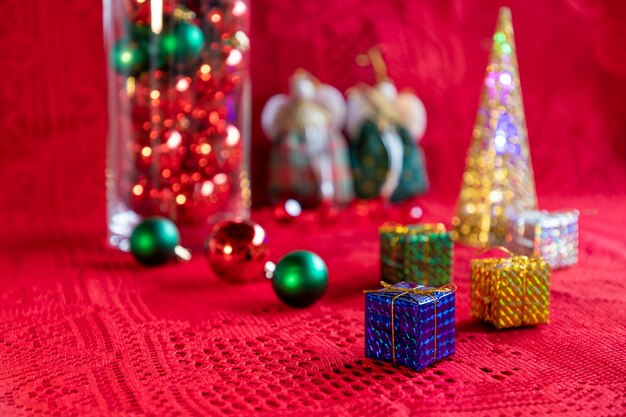 Christmas arrangement with gift packages balls and ornaments and blurred background