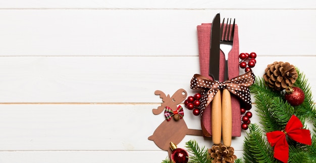 Christmas arrangement with tableware and bow