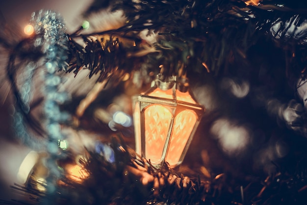 Christmas atmospheric . A close-up fragment of a Christmas tree with toys, lights of gerland