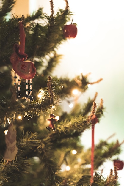 Christmas background of a beautiful decorated tree with lights and shiny balls